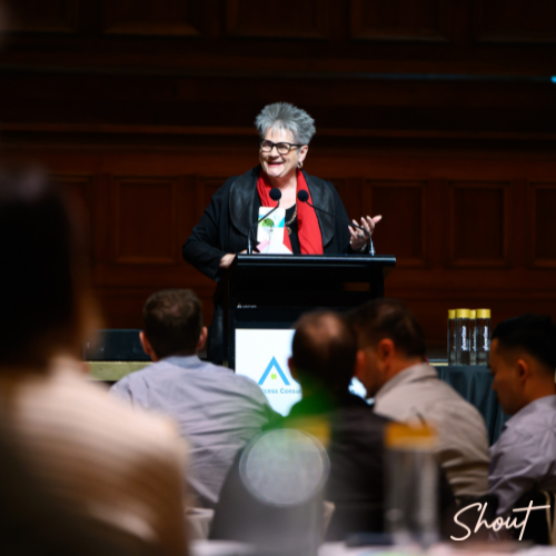 A speaker engaging an audience at a conference or seminar.