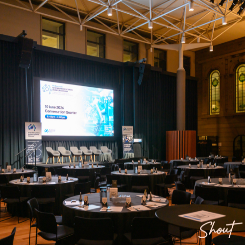 Conference venue set up by SHOUT Productions for the National Manufacturing Workforce Forum at the State Library of Victoria with stage, seating and delegate tables ready for attendees.